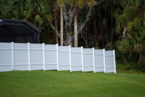 Should A Vinyl Fence Touch The Ground?